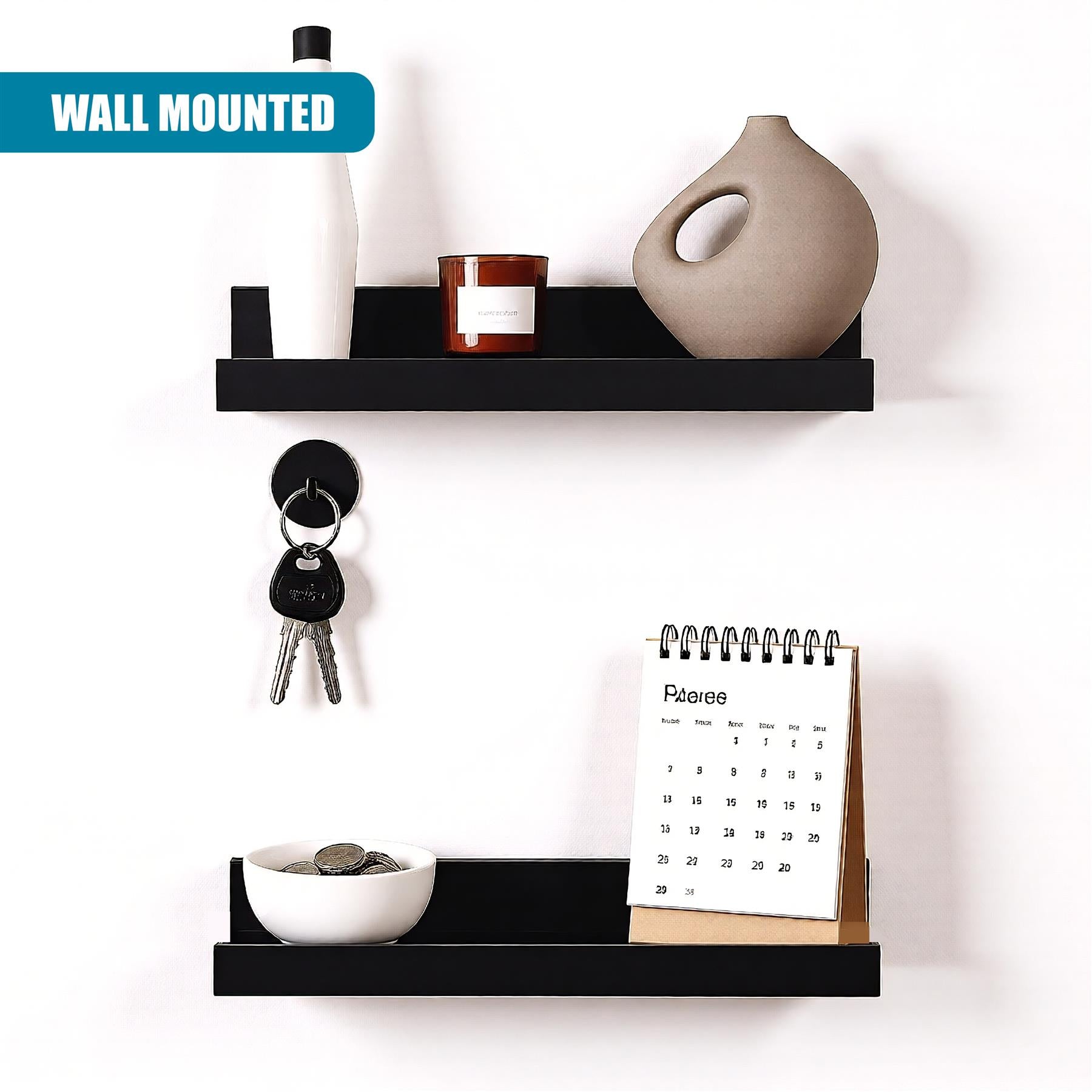 A wall-mounted shelf with two black shelves, one above the other. The top shelf has a white water bottle, a brown candle, and a beige vase. The bottom shelf has a bowl of coins, a calendar, and a set of keys. - The Magic Toy Shop