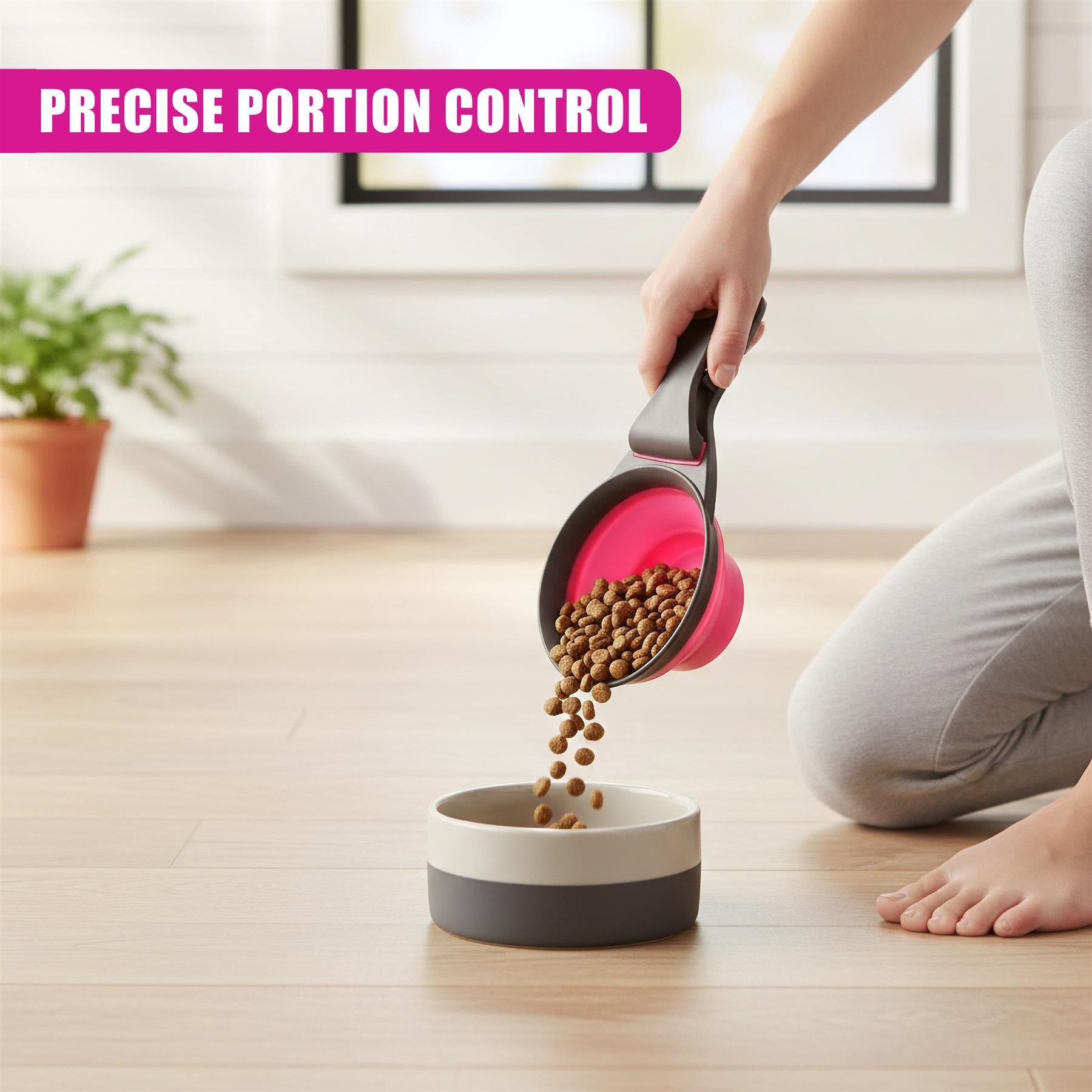 Hand pours dry pet kibble from a scoop into a small food bowl on a light wooden floor.