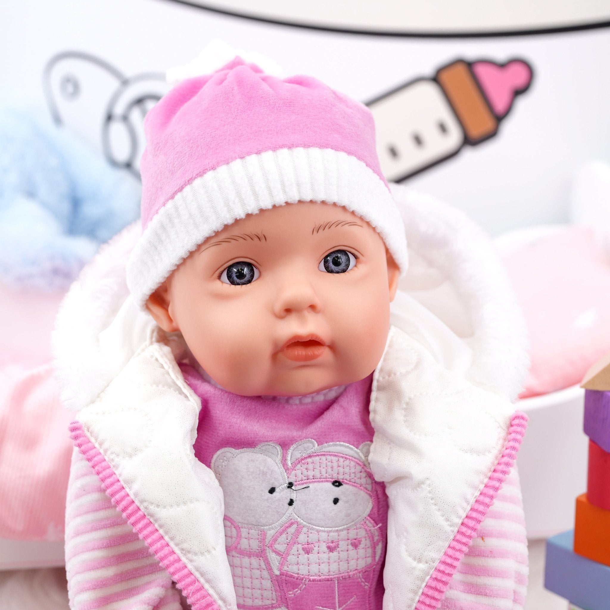 pink baby doll with white fur hat - The Magic Toy Shop