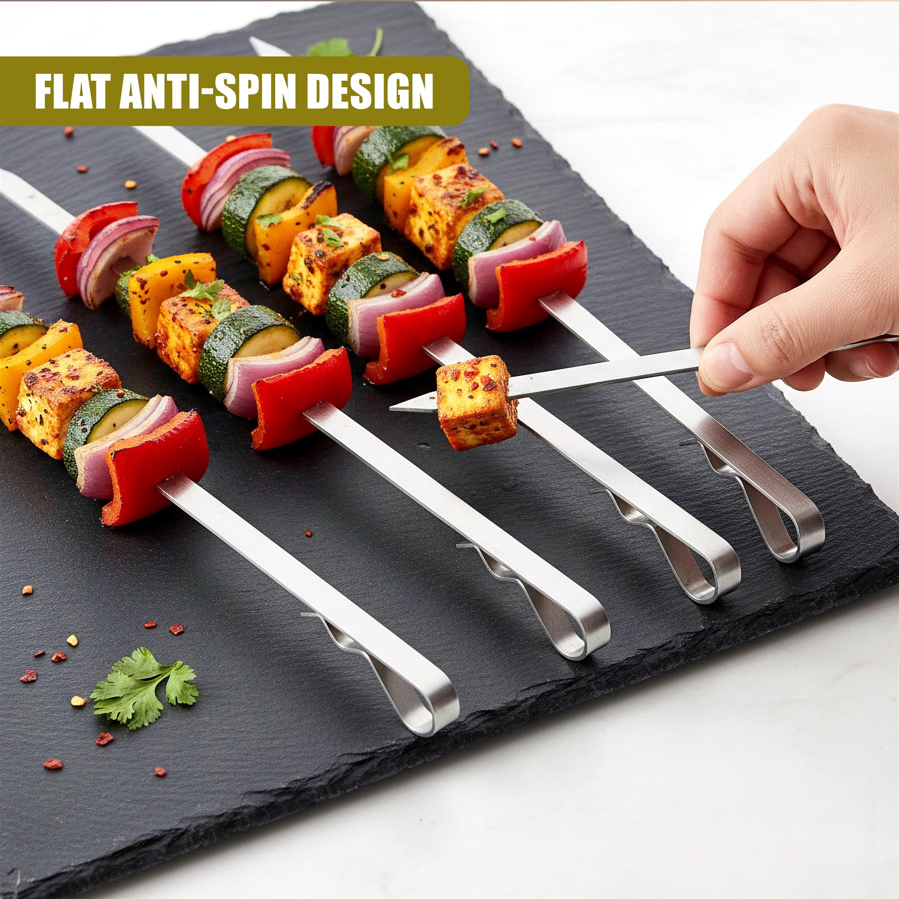 Several flat skewers holding cooked vegetables and meat are arranged on a black slate serving board.