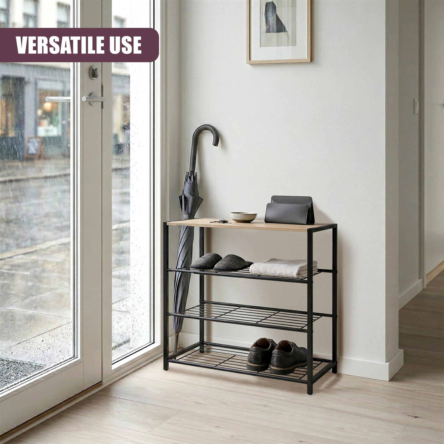 Three-tiered black metal shoe rack with a small upper shelf near a large window.