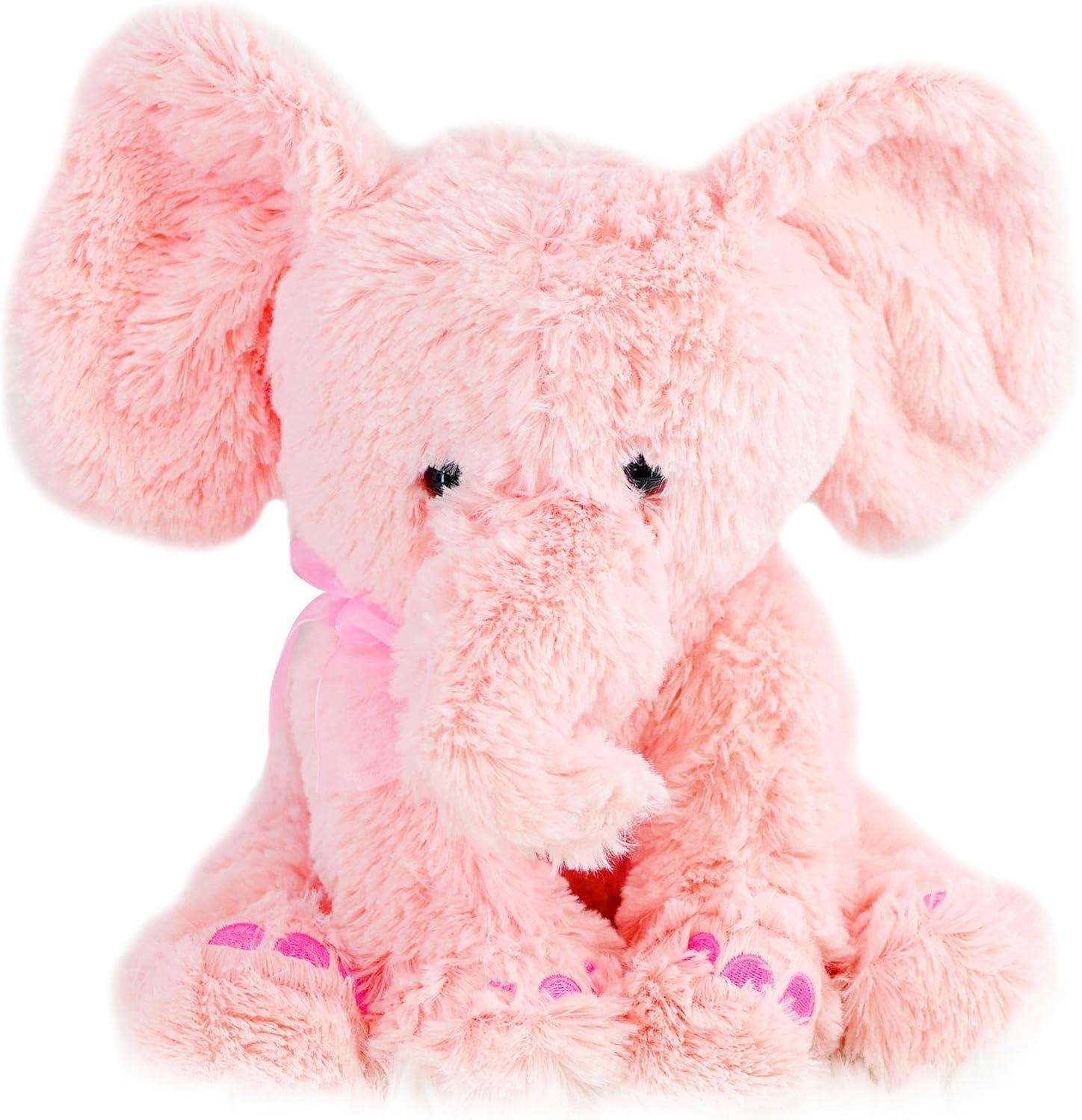 Plush stuffed toy of a pink elephant featuring large floppy ears and a trunk.