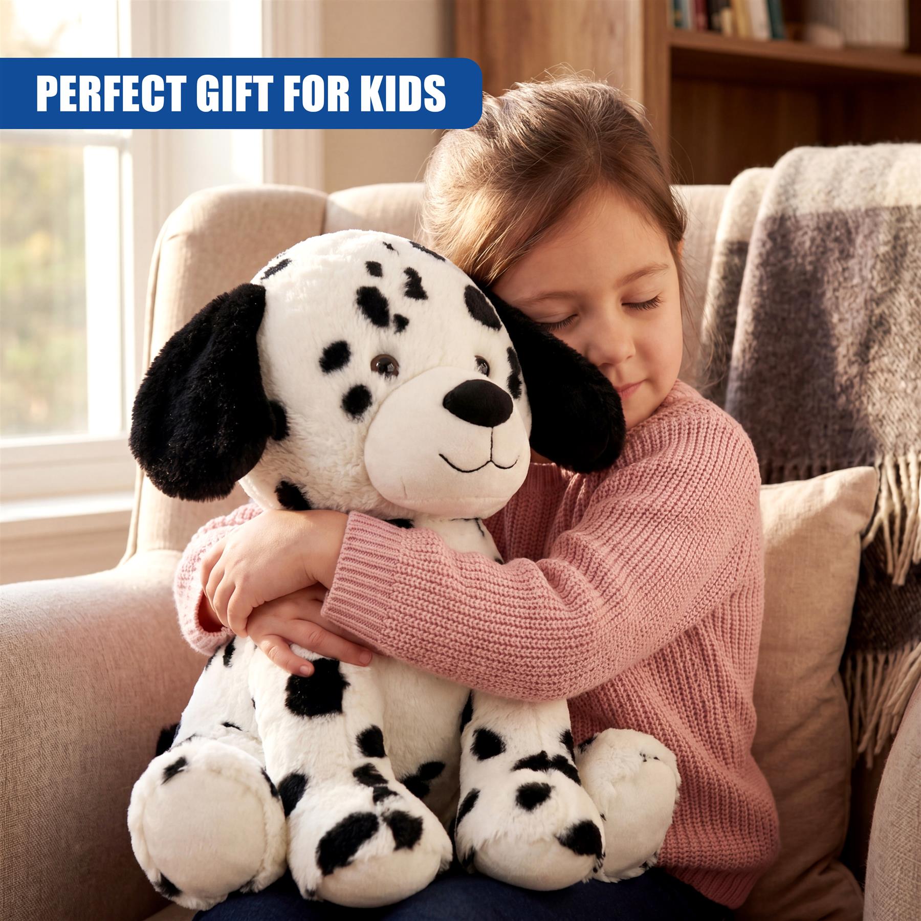 Girl hugging a spotted plush toy; the toy is a Dalmatian soft toy.