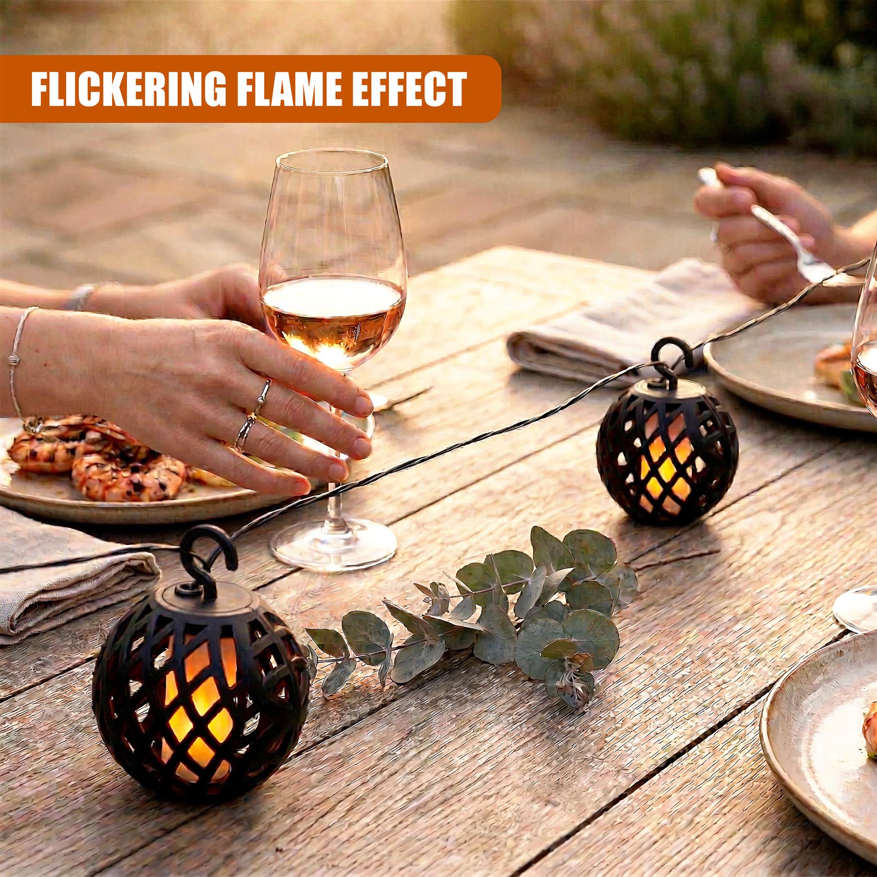Solar string lights with patterned rattan orbs are displayed on a rustic wooden table surface.