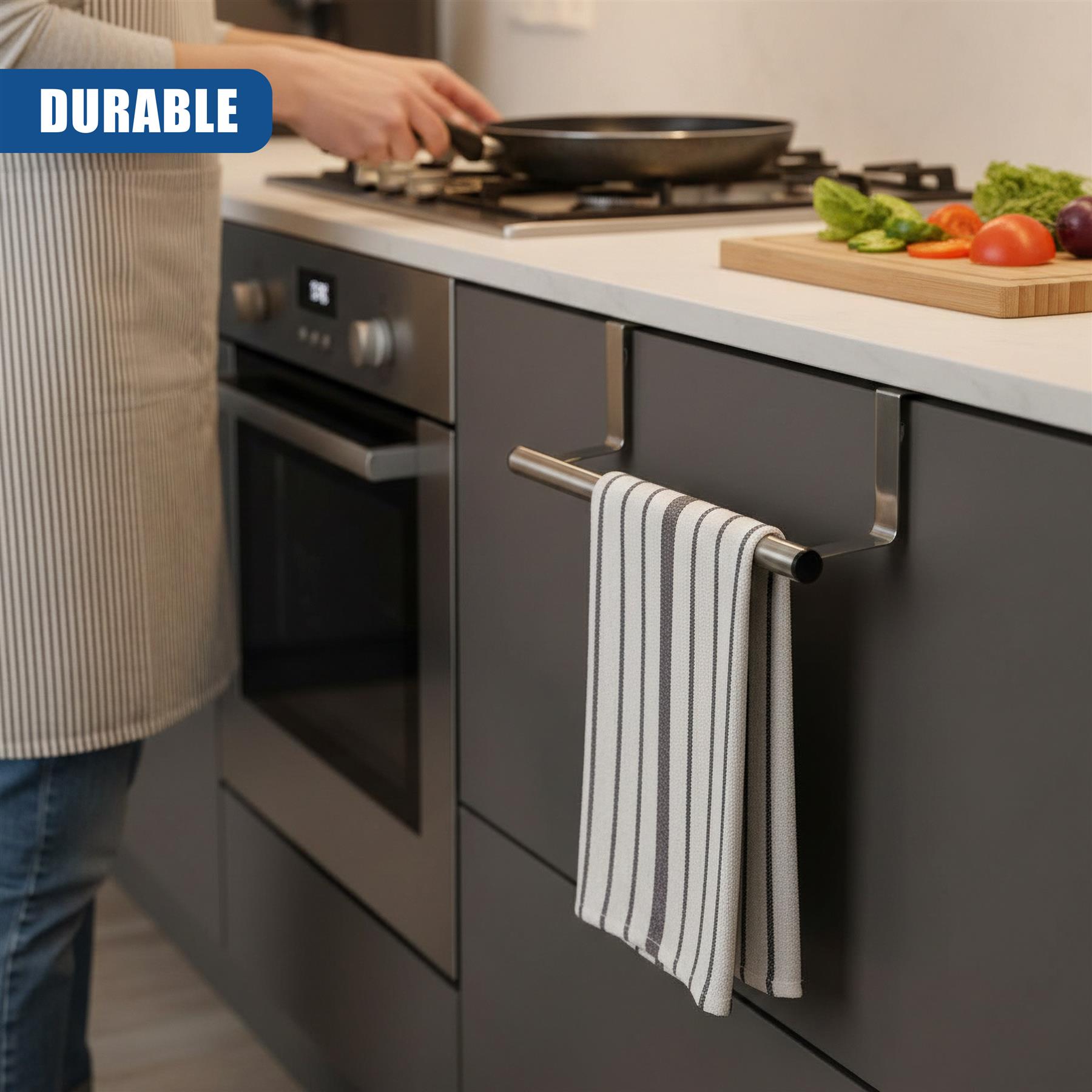 Metal towel rail attached to cabinet, holding two striped tea towels in a kitchen setting.