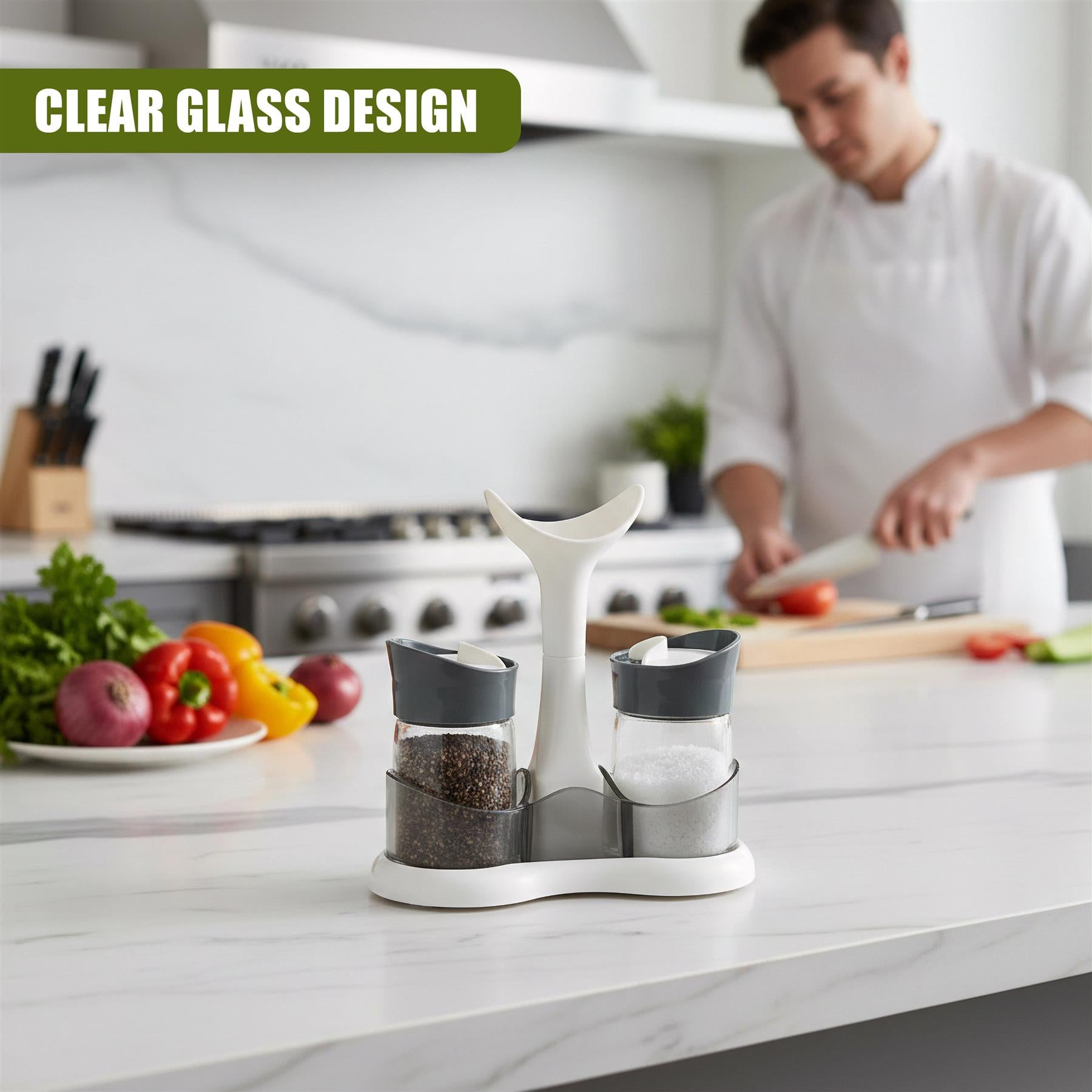 Three clear glass spice dispensers sit on a white tray on a kitchen counter.