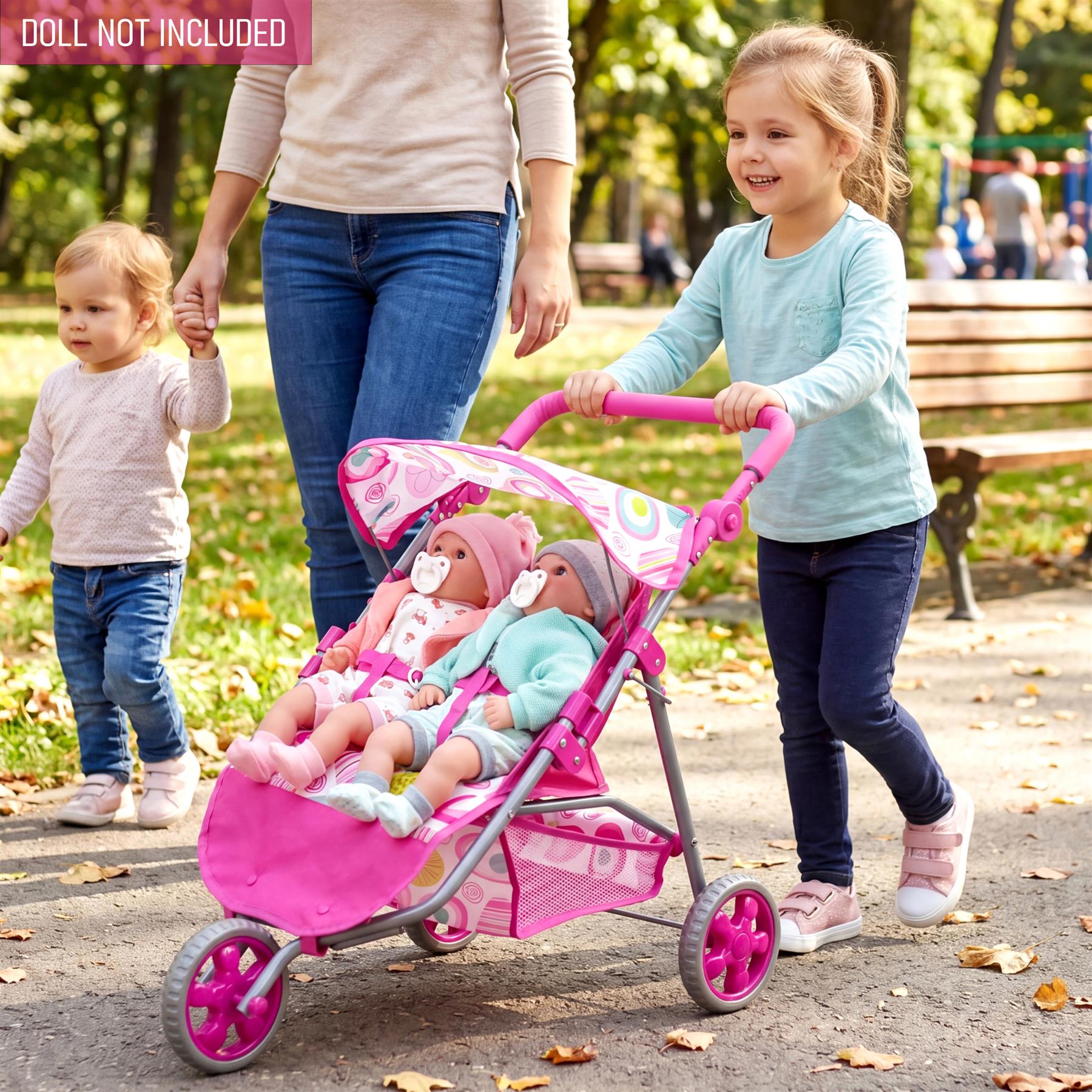 Pink three-wheeled doll pushchair with detachable carriage and black wheels.