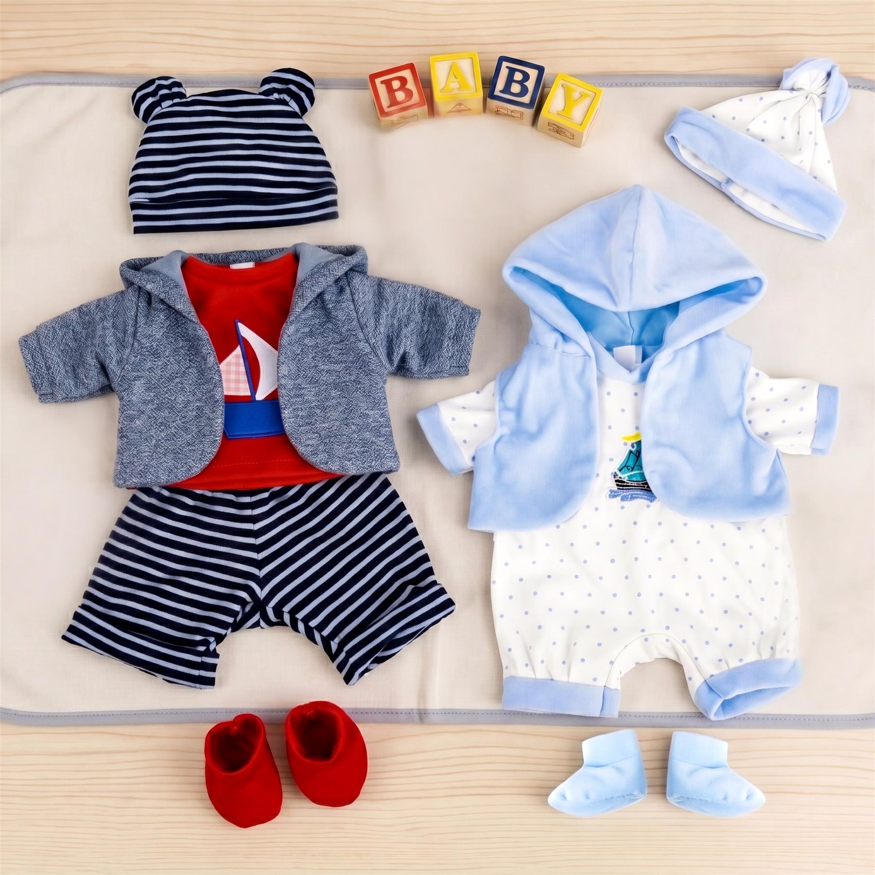 Multiple baby clothing sets displayed, featuring striped outfits, blue rompers, and matching accessories.