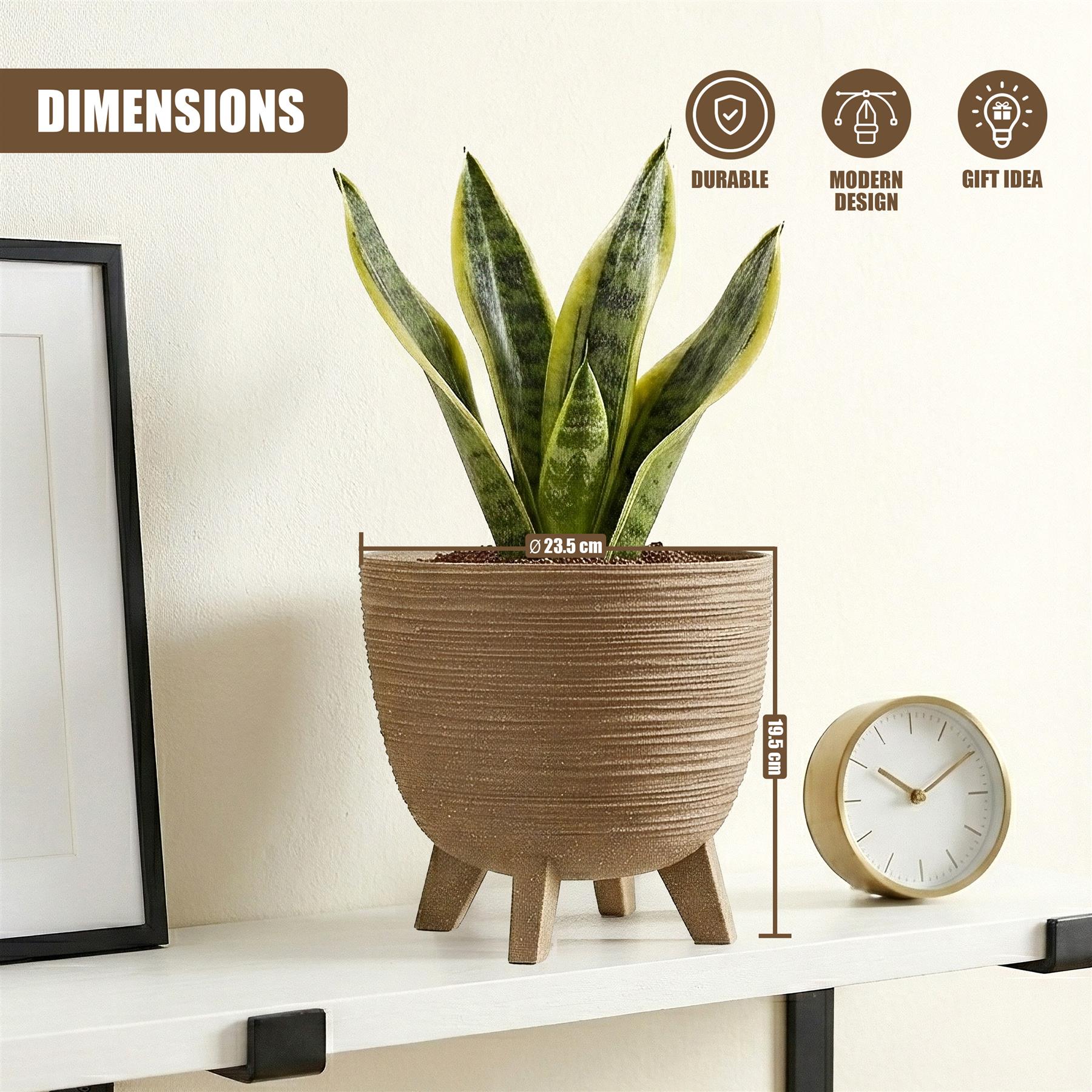 A textured brown pot with short legs holds a vibrant green foliage plant on a white shelf.