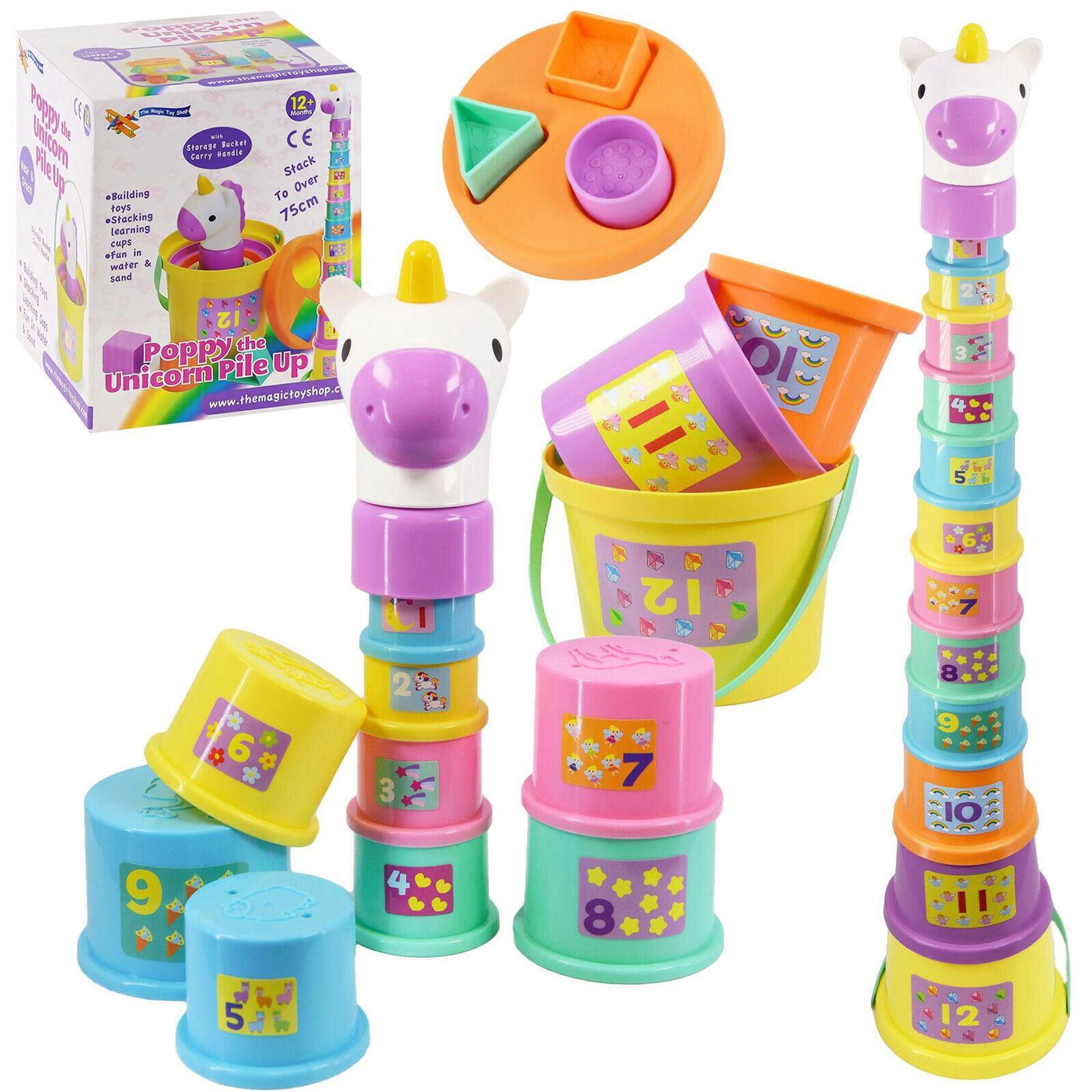 A colorful toy set featuring numbered plastic stacking cups and a unicorn-themed stacking tower.