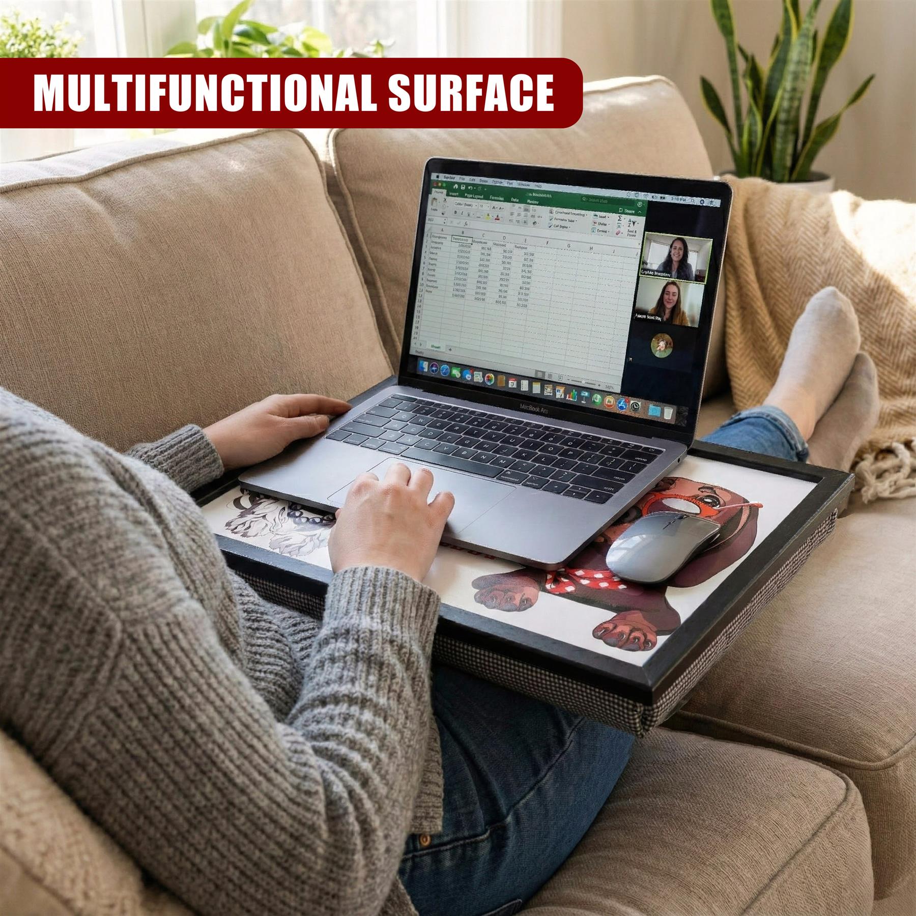 The patterned lap tray holds an open laptop displaying a spreadsheet and a wireless mouse.