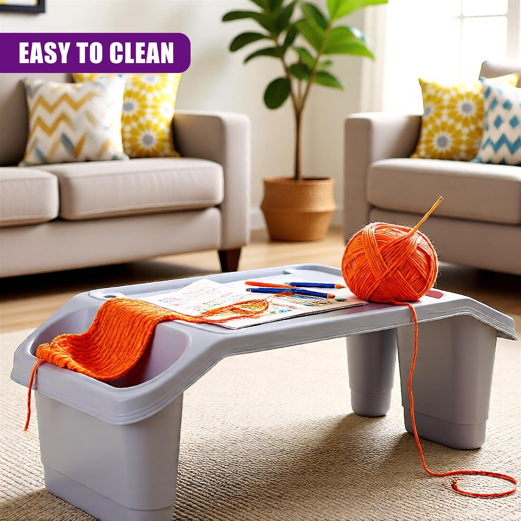 A grey, compact table with a built-in storage bin, designed for kids to work on crafts or play with toys. The table features a tray with a small storage bin, a built-in cup holder, and a built-in tray with a storage bin. - The Magic Toy Shop