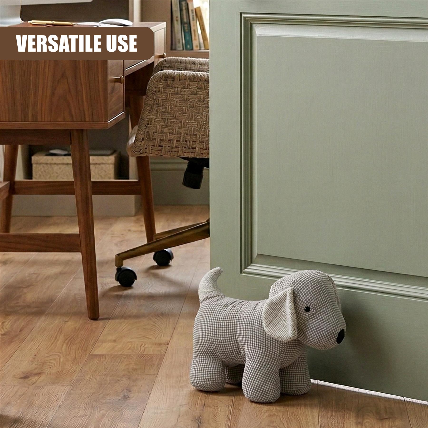 A stuffed dog figurine, acting as a door stopper, rests against a light sage green door panel.