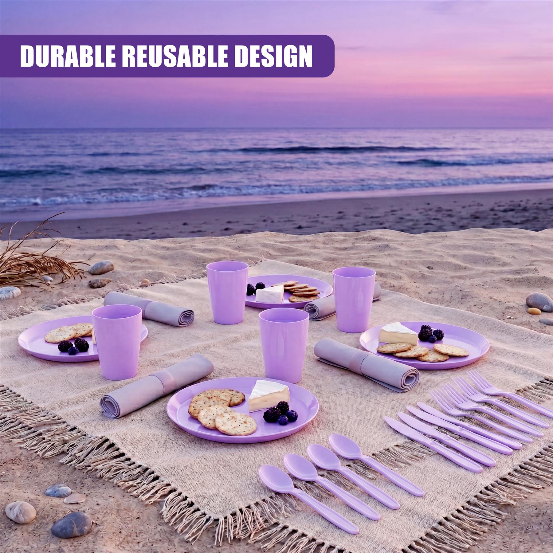 Purple reusable picnic set laid out on beach sand includes plates, cups, and utensils.