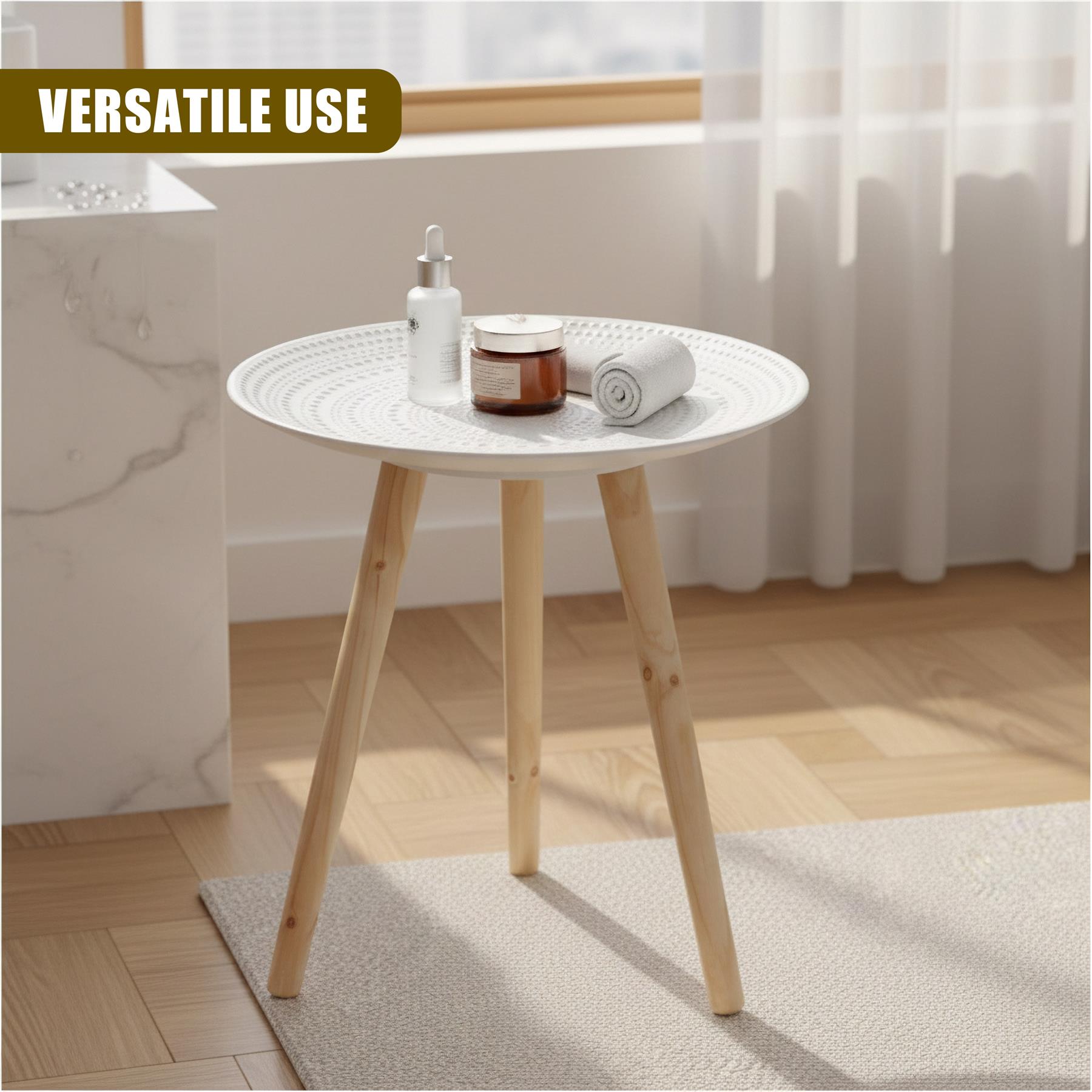 White round table with wooden legs holding soap, cream, and a small rolled towel.