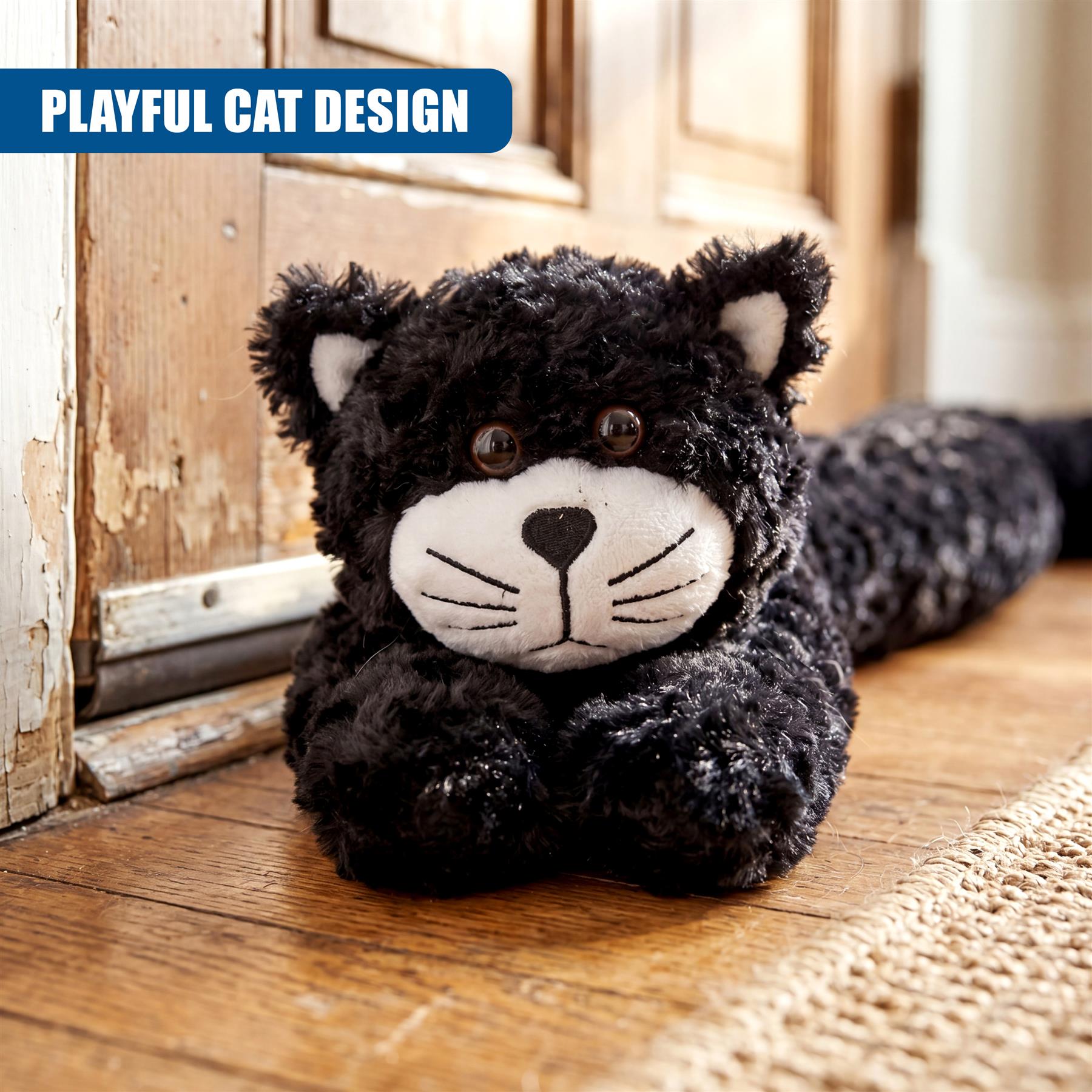Black stuffed cat novelty draught excluder with embroidered whiskers on a wooden floor.