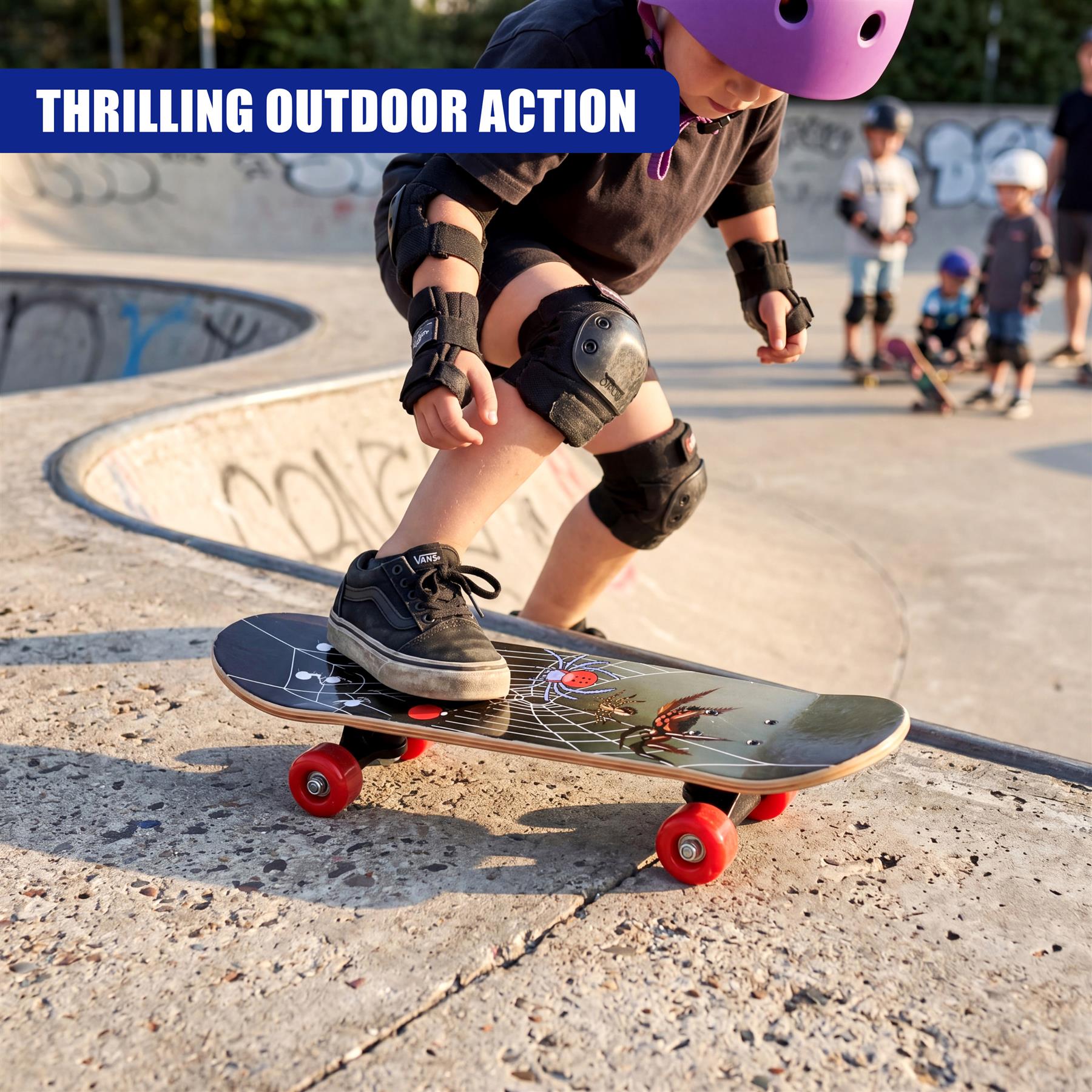 A skateboard with red wheels rests on concrete in an outdoor skate park environment.